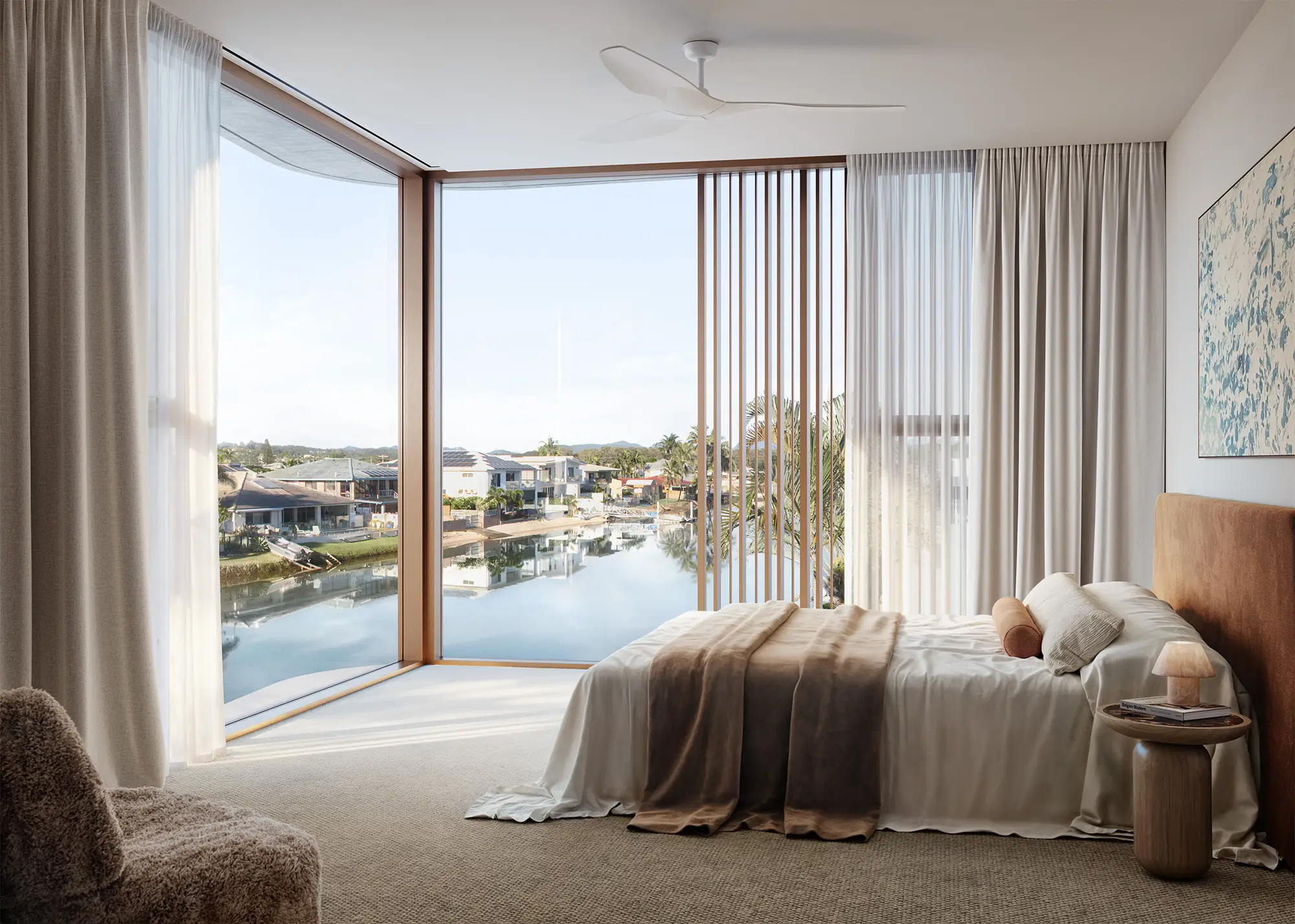 Master bedroom with expansive glazing over the canal
